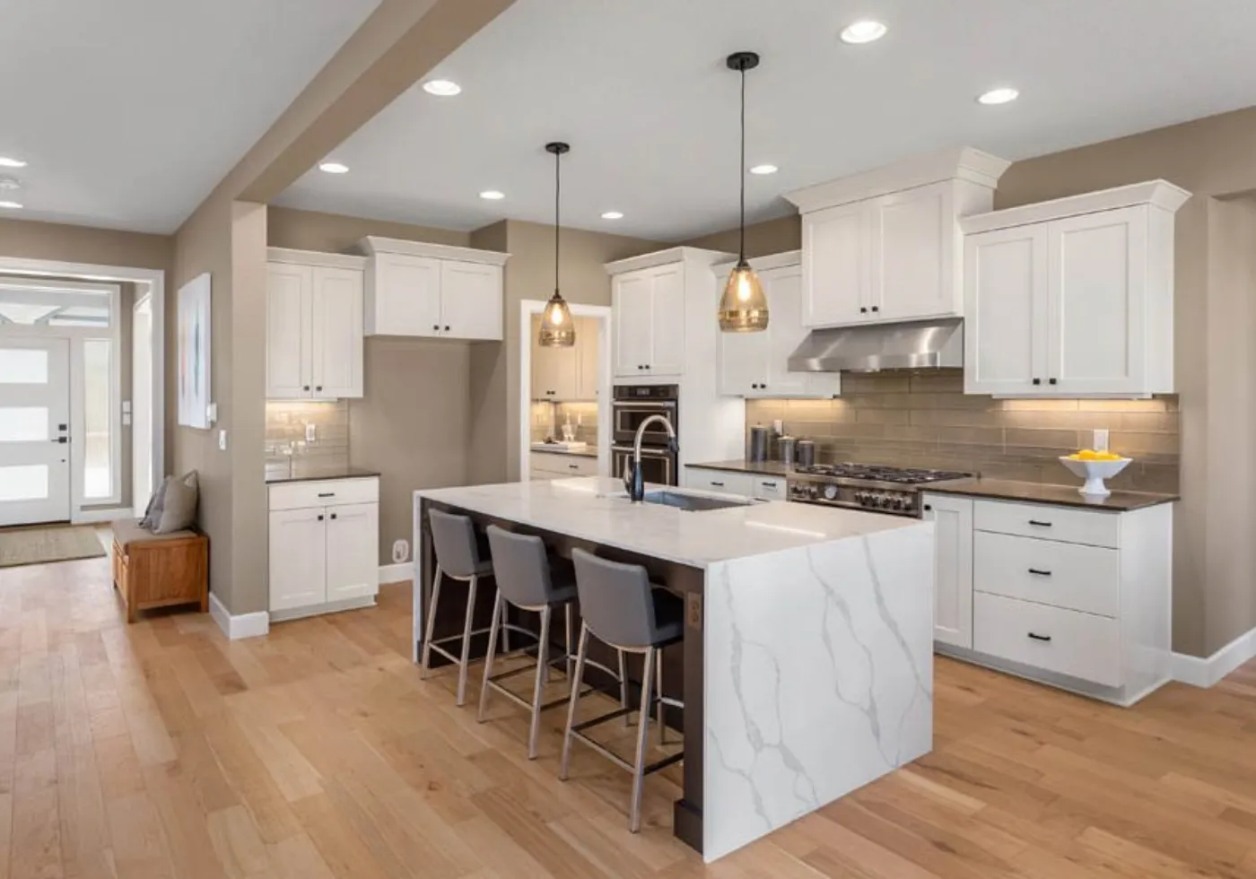 Quartz kitchen countertop and island being measured
